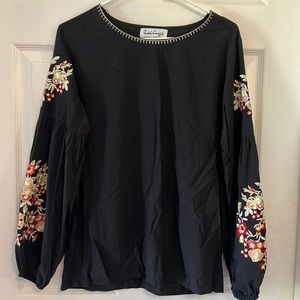 Black top with embroidery detail